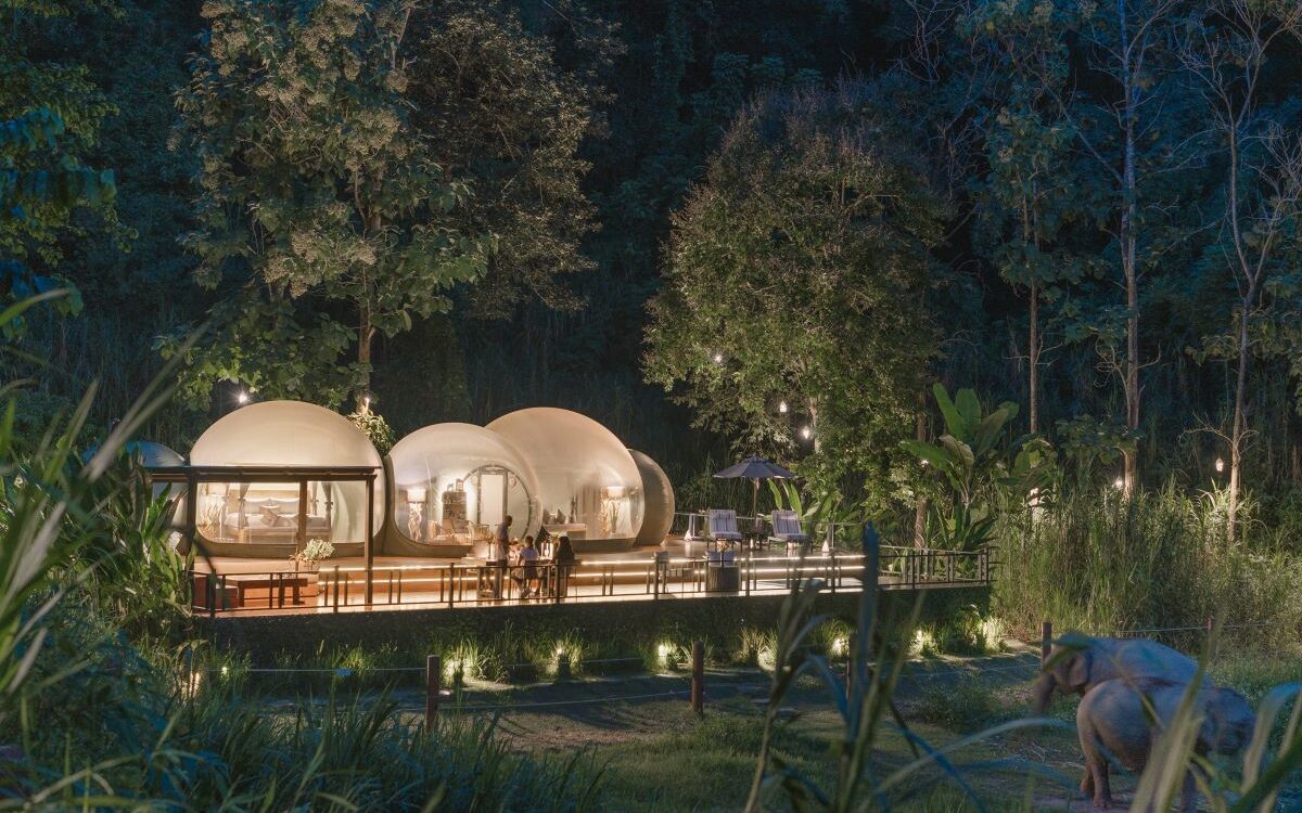 A collection of jungle bubbles in Anantara Golden Triangle Elephant Camp & Resort surrounded by elephants which is one of the standout properties in northern Thailand's golden triangle - Luxury Escapes