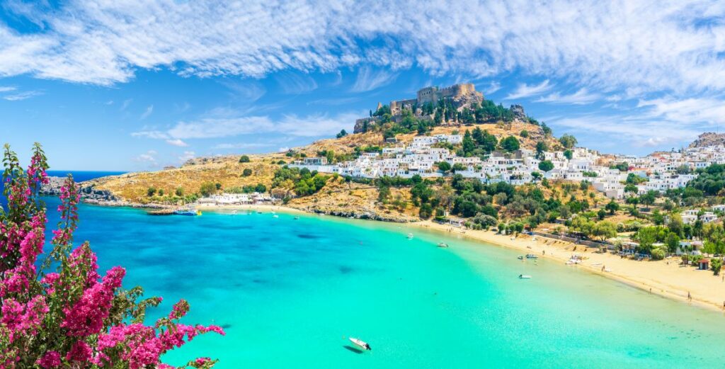 The picturesque village of Lindos on the island of Rhodes is a must-see for sun-seekers visiting Greece in September, during the quieter shoulder season - Luxury Escapes