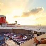 A solo traveller onboard a Virgin Voyages cruise ship, showing reasons to go on a solo cruise