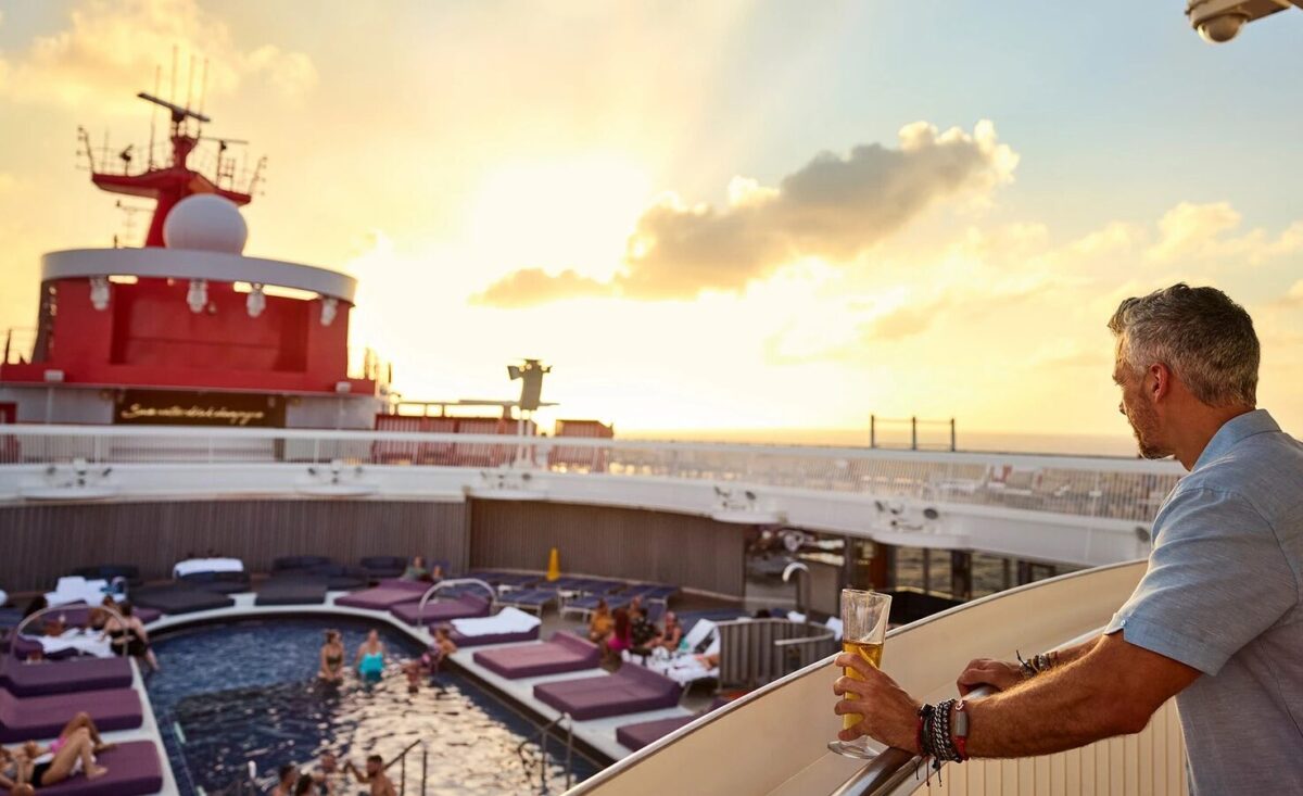 A solo traveller onboard a Virgin Voyages cruise ship, showing reasons to go on a solo cruise