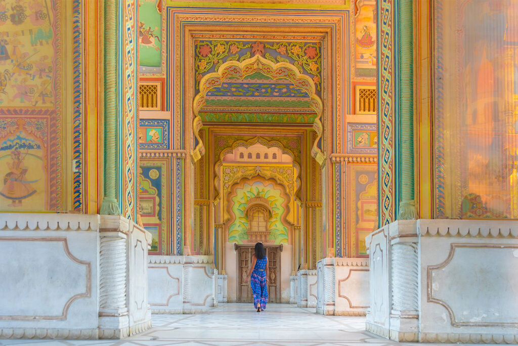 A woman walk's through India's historic majesty.