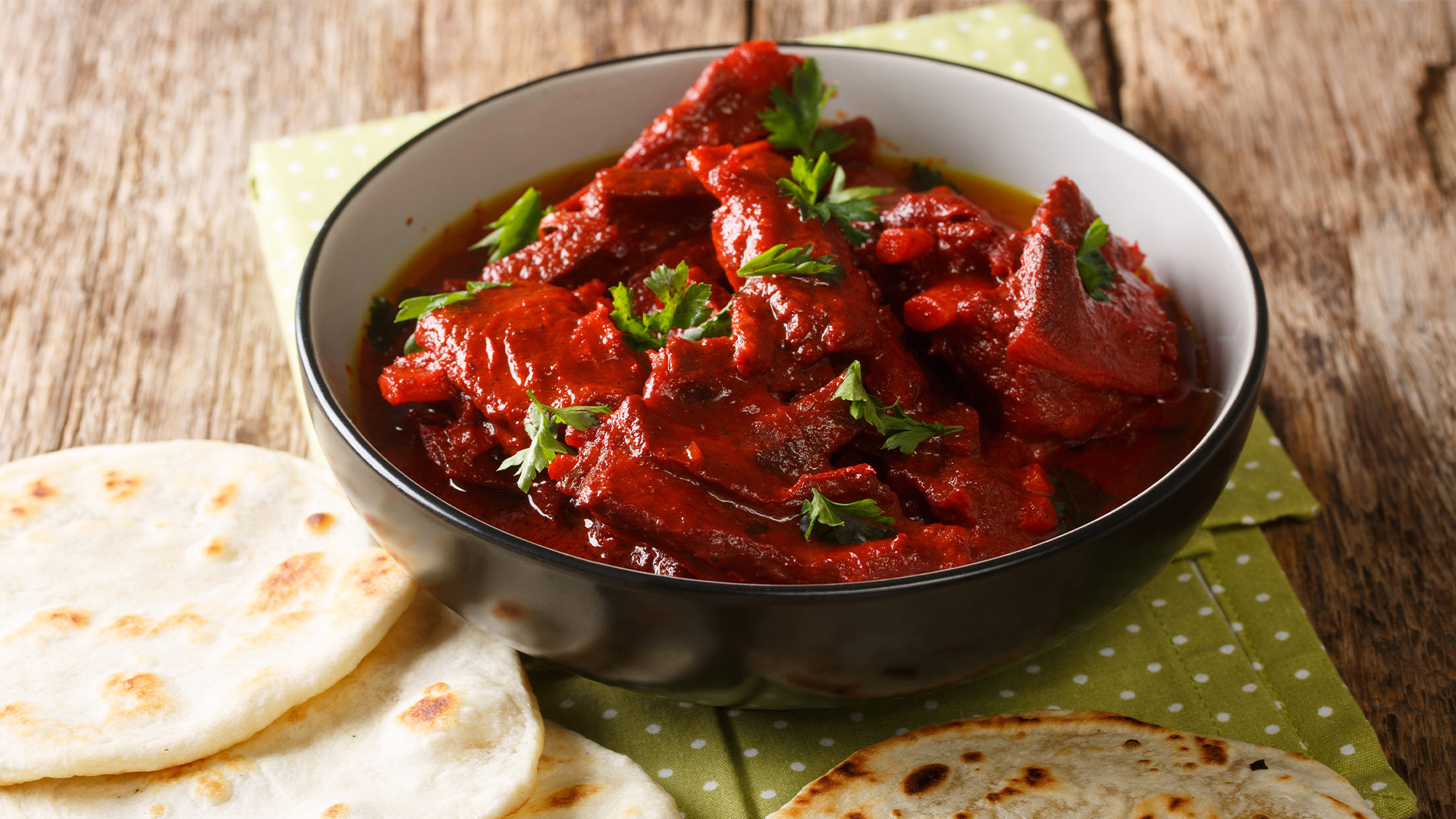 A hearty bowl of Rajasthani laal maas is a must-try for meat-lovers exploring the culinary treats of India's Golden Triangle – Luxury Escapes