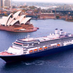 Holland America ship sailing past the Opera House in Sydney, facts about Holland America Cruise lines - Luxury Escapes