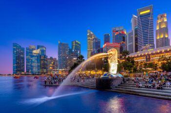 Night view of Marina Bay in Singapore, a central area and home to some of the best hotels in the city - Luxury Escapes