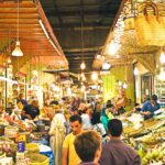 A food market at night in Fez, Morocco, a great destination to take a food tour - Luxury Escapes.