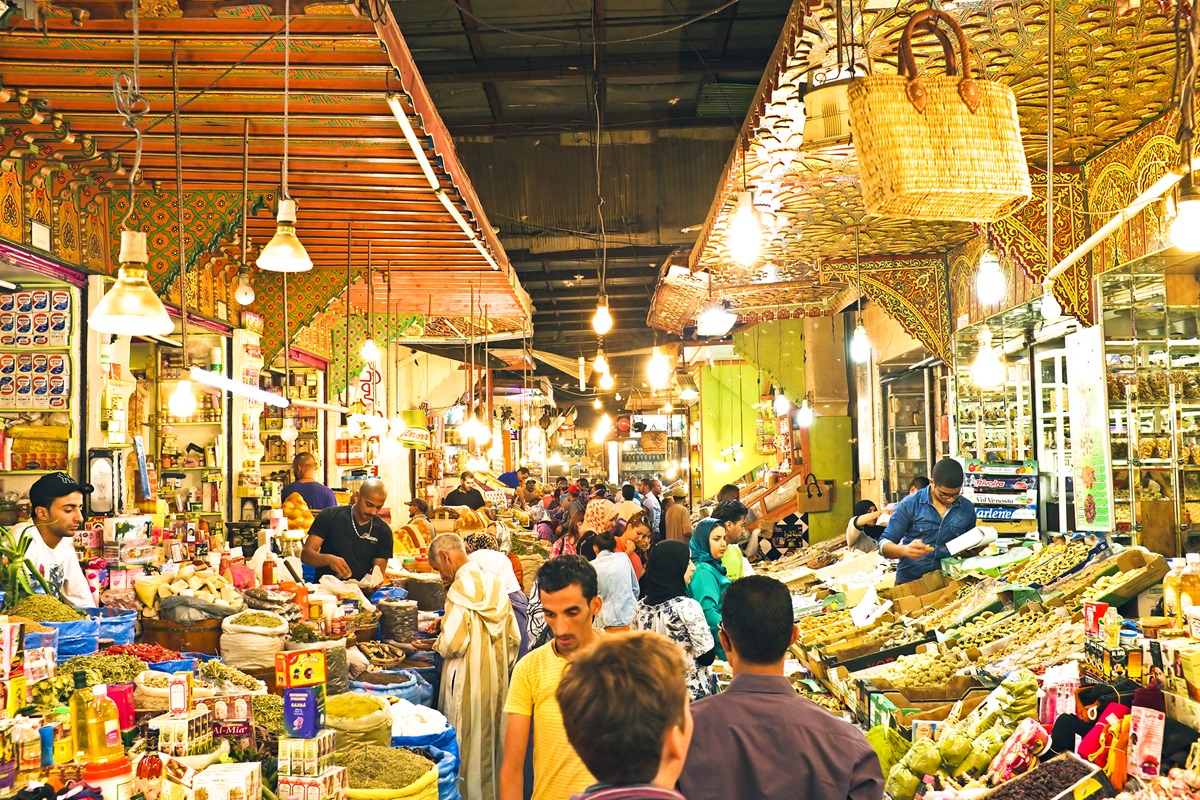 A food market at night in Fez, Morocco, a great destination to take a food tour - Luxury Escapes.