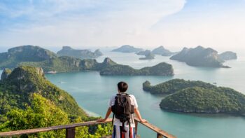 A first-time traveller looks over Ang Thong Island National Park, just one of Thailand's beautiful nature reserves- Luxury Escapes