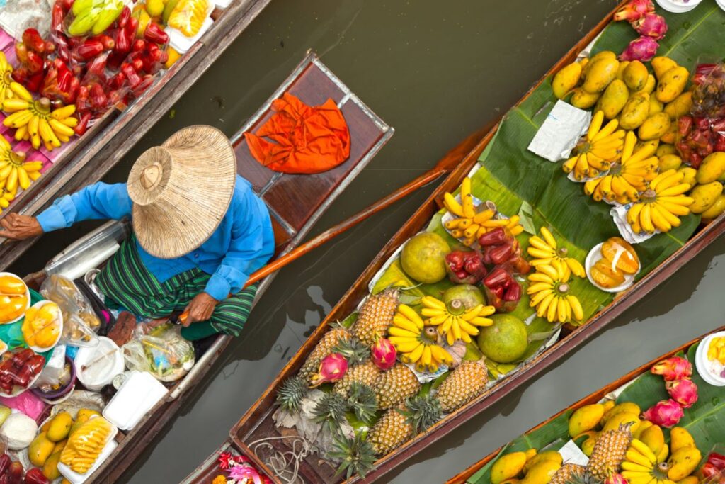 Floating market in Thailand, one of the best destinations in the world for street food - Luxury Escapes 