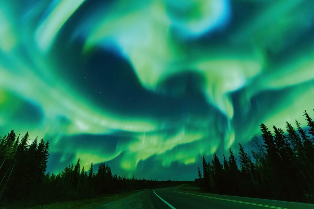 See the colourful Northern Lights which is just one of the many reasons to visit Canada in winter - Luxury Escapes