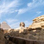 The Great Sphinx of Giza with the Pyramids in the background, some of Egypt's most significent attractions - Luxury Escapes