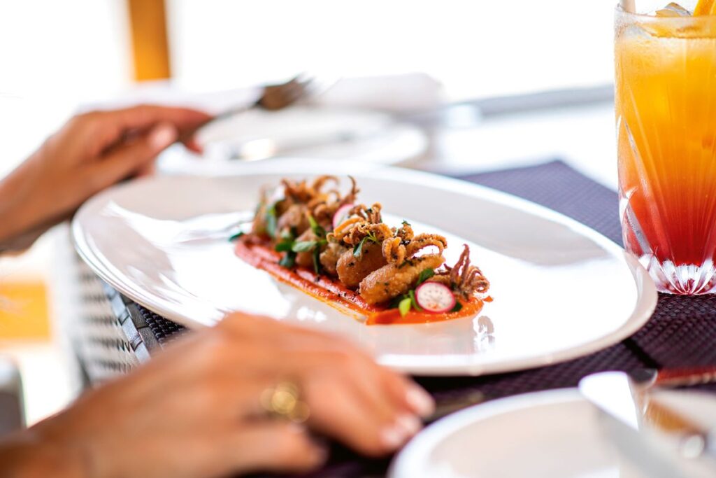 A plate of fried squid at one of the restaurants in Hideaway Resort & Spa, one of the best resorts to stay solo in the Maldives - Luxury Escapes