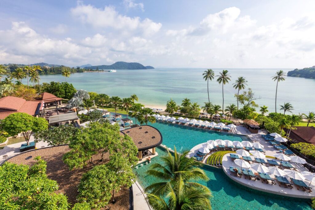 An aerial shot of the large lagoon pool of Pullman Phuket Panwa Beach Resort, one of the best places to stay in Phuket - Luxury Escapes