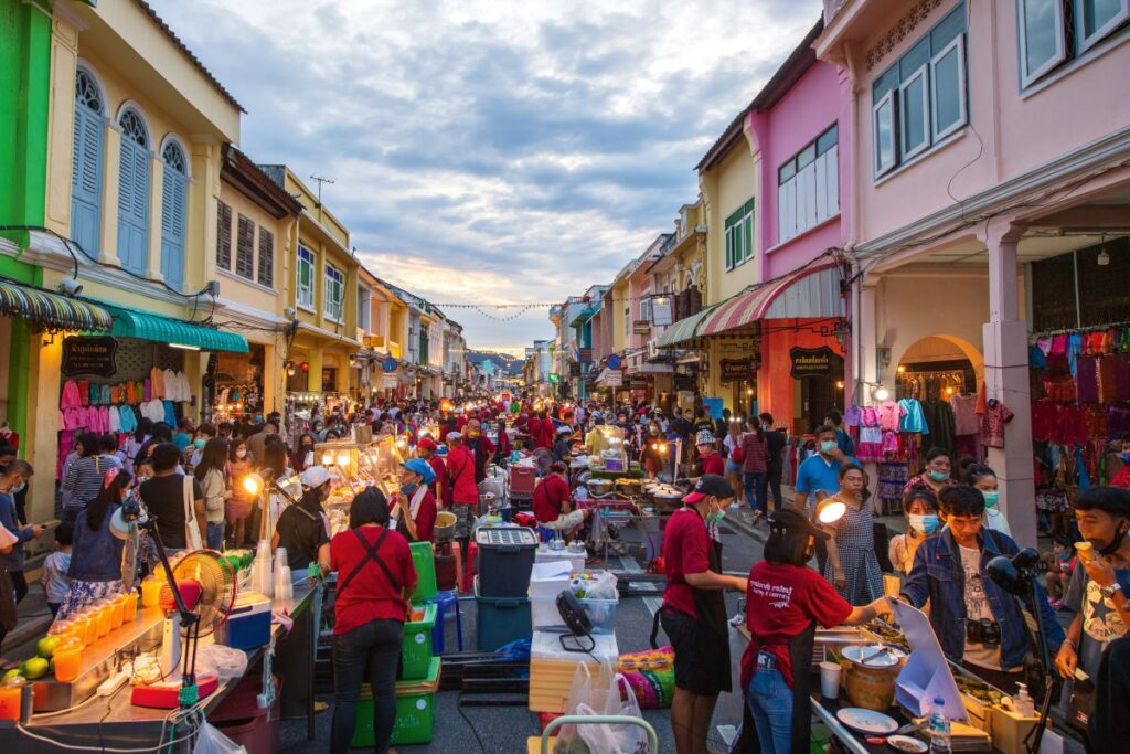 A crowd of people shopping at Phuket's Downtown Market, one of the best activities to do in the city - Luxury Escapes