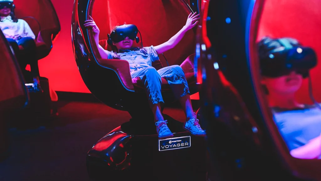 A kid enjoying the virtual reality experience at MAX at Melbourne Skydeck - Luxury Escapes
