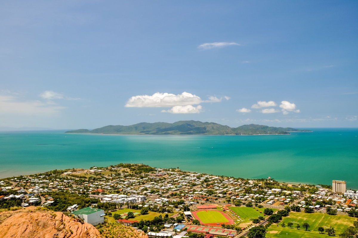 Panorama of Townsville, Queensland, Australia, with Magnetic Island in the background, seen from Castle Hill viewpoint - Luxury Escapes