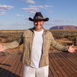 Miguel Maestre standing in front of Uluru - Luxury Escapes