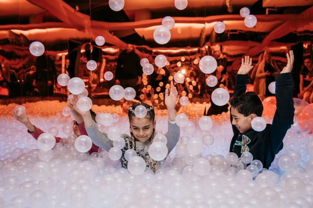 Kids playing in the ball pit at Chaos Lab in the Docklands for a family-fun, kid-friendly thing to do in Melbourne - Luxury Escapes