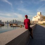 Doha, featuring a member of Qatar Airways cabin crew, which recently welcomed Sana 2.0 as the world's first AI flight attendant - Luxury Escapes