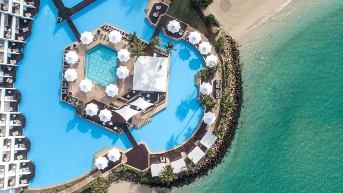 An aerial view of the swimming pool at InterContinental Hayman Island - Luxury Escapes