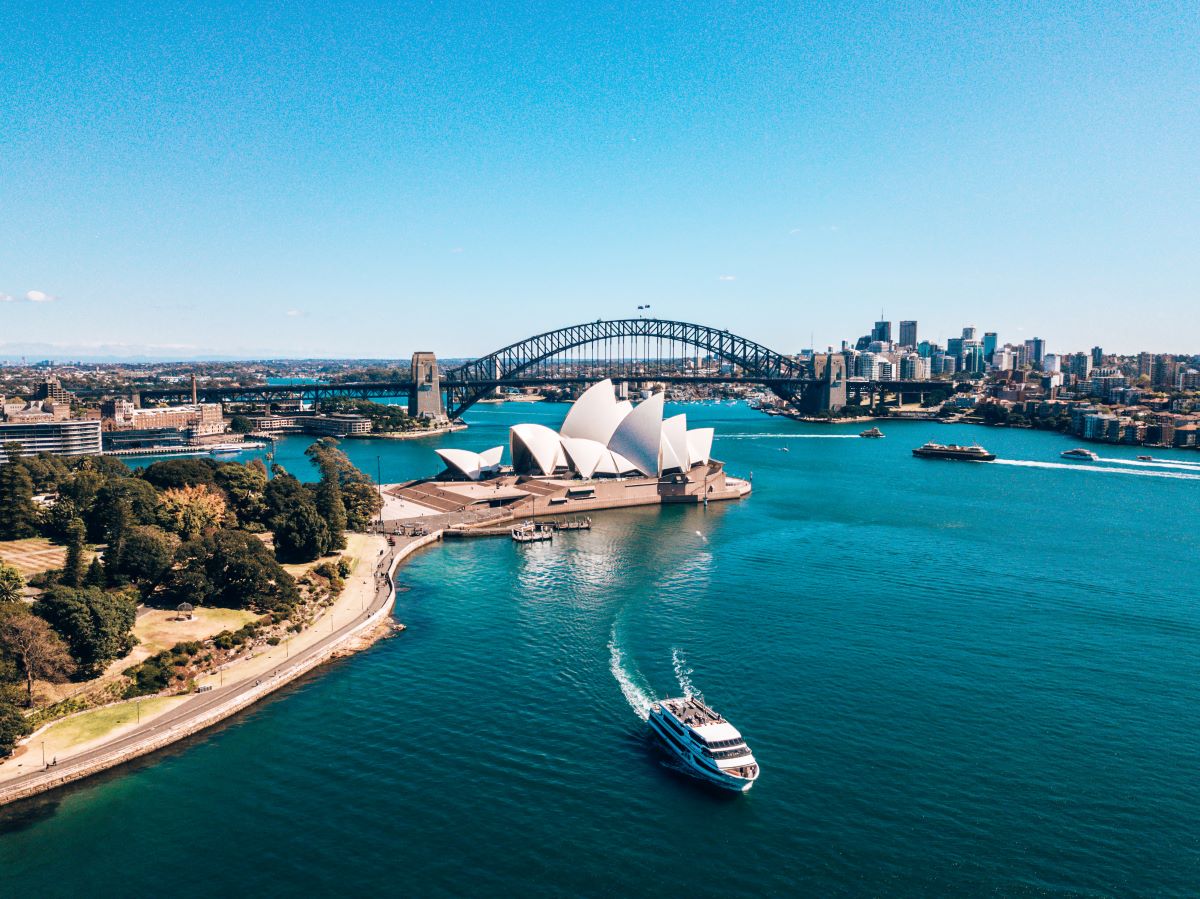 An aerial shot of the Sydney Habour, one of the top things to do in Sydney - Luxury Escapes