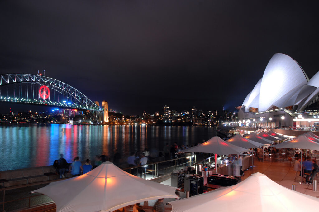 Views over Sydney Harbour Bridge at night to illustrate Sydney's best restaurants - Luxury Escapes