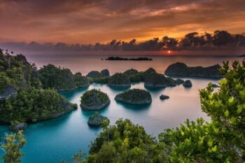 Sunset views over Raja Ampat, Indonesia's eastern paradise - Luxury Escapes
