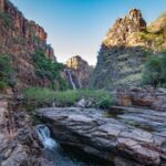 Waterfall flowing at Kakadu in the Northern Territory - Luxury Escapes