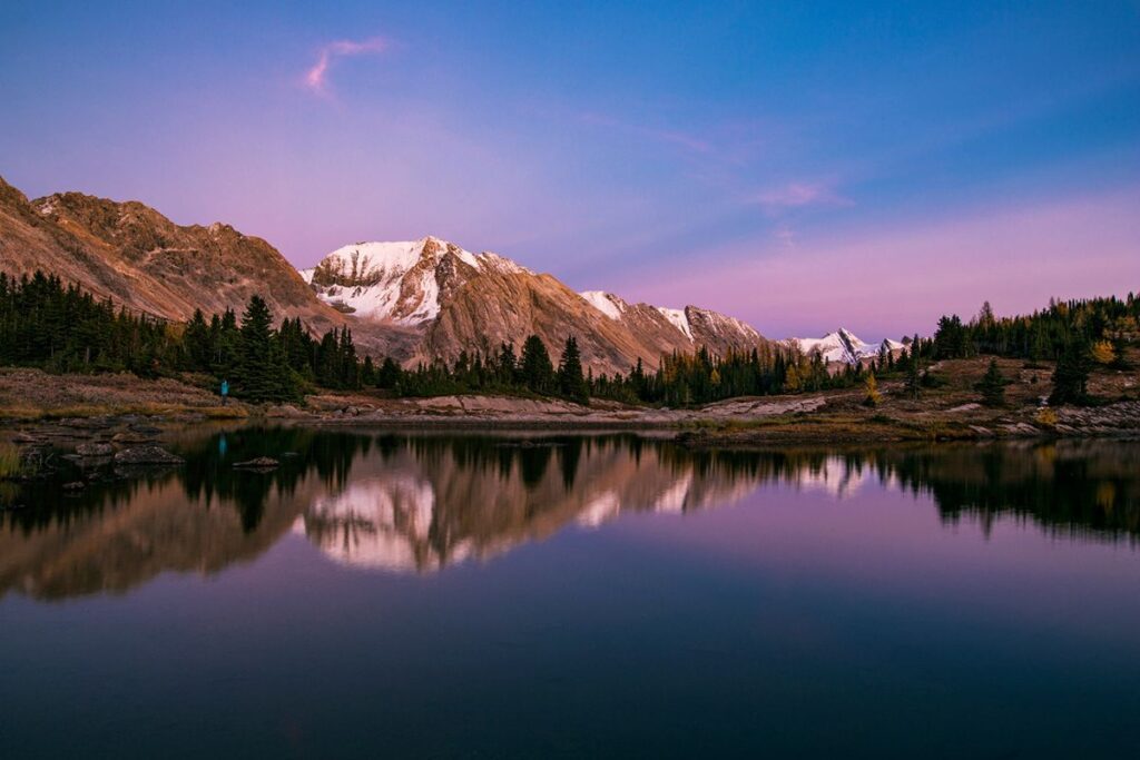 The sunrise turns the sky pink over Baker Lake in Canada, one of the top bucket list destinations for 2025 - Luxury Escapes