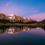 The sunrise turns the sky pink over Baker Lake in Canada, one of the top bucket list destinations for 2025 - Luxury Escapes