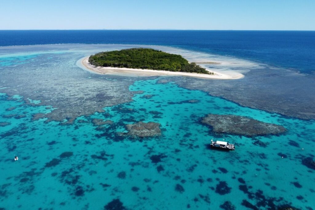 Lady Musgrave Island, one of the Great Barrier Reef’s biggest swimming pools, is one of the best places to travel in Australia in July - Luxury Escapes