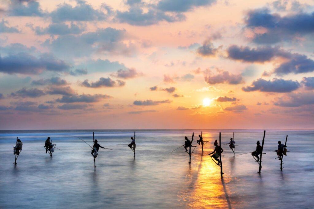 Traditional stilt fisherman in Sri Lanka - Luxury Escapes