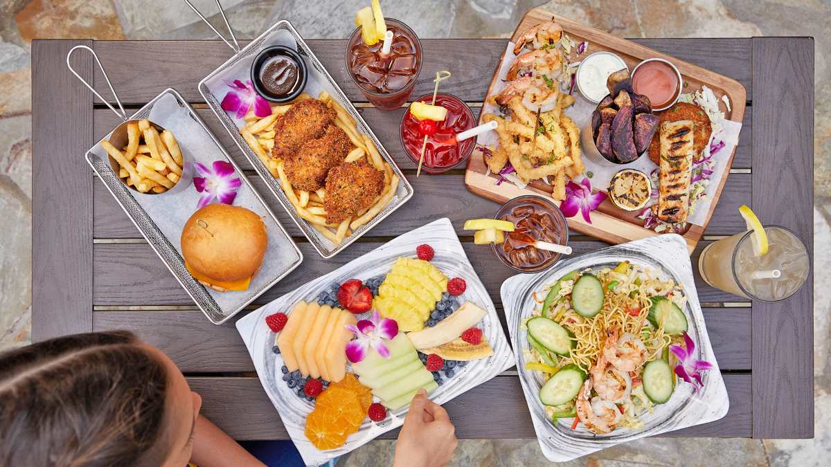 Delicious lunch spread at Duke's Waikiki, Outrigger Reef Waikiki Beach Resort - Luxury Escapes