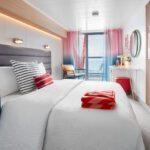 A spacious cabin onboard a Virgin Voyages cruise - Luxury Escapes