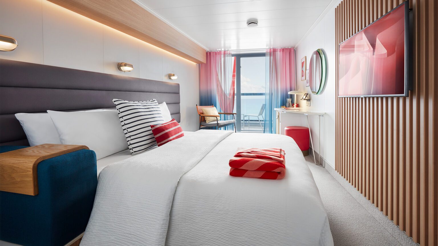 A spacious cabin onboard a Virgin Voyages cruise - Luxury Escapes