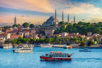 Ships in the harbour in Istanbul, Turkiye, with Turkish Airlines soon to launch non-stop flights from Sydney to Istanbul - Luxury Escapes