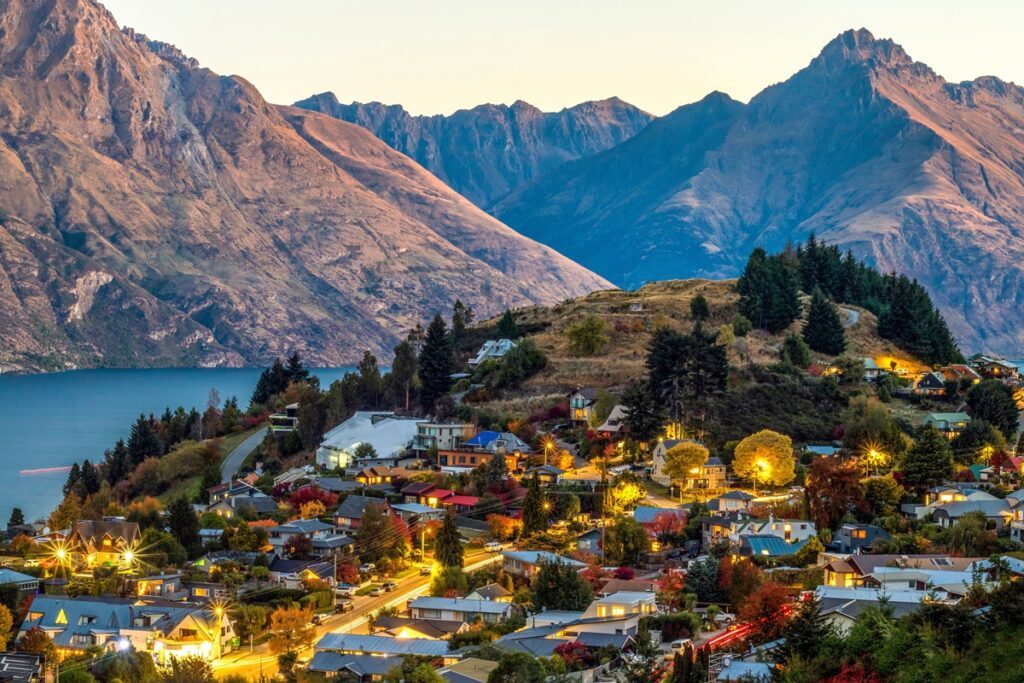 An ariel view of Queenstown with mountains in the background - Luxury Escapes