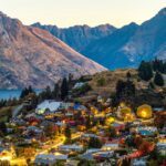 An ariel view of Queenstown with mountains in the background - Luxury Escapes