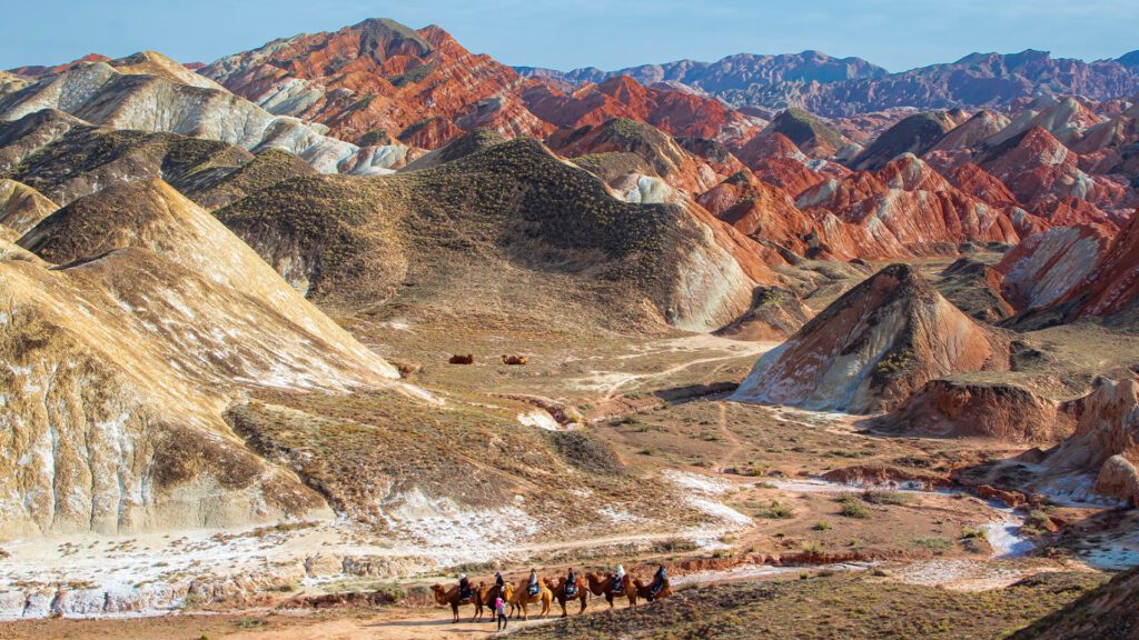 travellers on a camel crossing the silk road