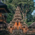 A Balinese-style temple in Ubud, full of intricate, tiered carvings and surrounded by lush jungle