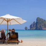 Mature,Couple,Relaxing,On,The,Beach,In,Thailand - LuxPLus+ members save thousands - Luxury Escapes