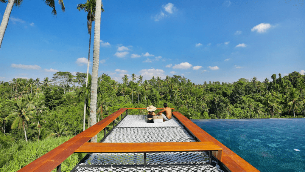 The infinity pool and swing at romantic escape Kaamala Resort Ubud - Luxury Escapes