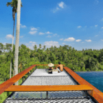 The infinity pool and swing at romantic escape Kaamala Resort Ubud - Luxury Escapes