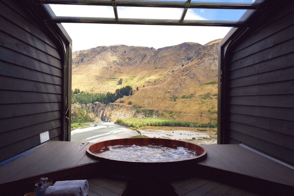 Settle into your private Japanese-style cedar hot tub at Queenstown's Onsen Hot Pools, filled with spring water heated to a balmy 38.5°C - Luxury Escapes