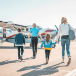 A family approaches Westwind Air Service on the way to their next awesome family holiday - Luxury Escapes