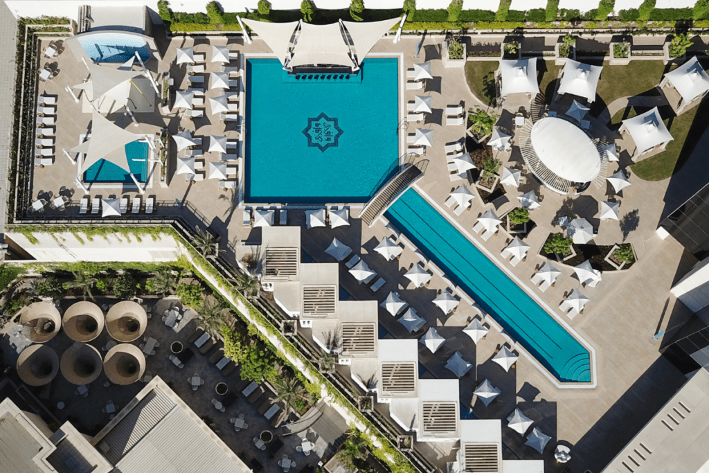 Designed in the shape of the Egyptian ankh, or ‘key of life’, this stunning pool boasts a bridge with a gently cascading waterfall and plenty of sun loungers - Luxury Escapes