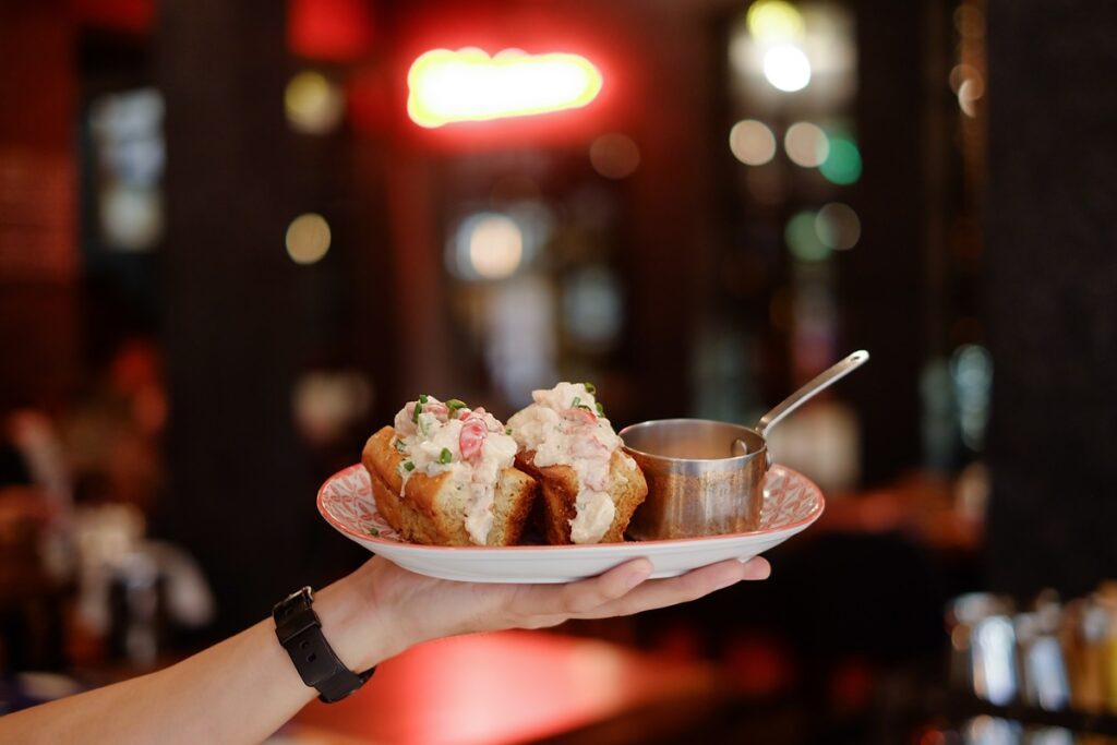 A lobster roll in Maine, one of America's most iconic foods - Luxury Escapes