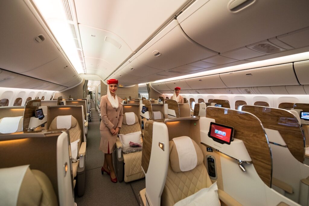Wide shot of the Emirates flight B777-300ER business class cabin - Luxury Escapes