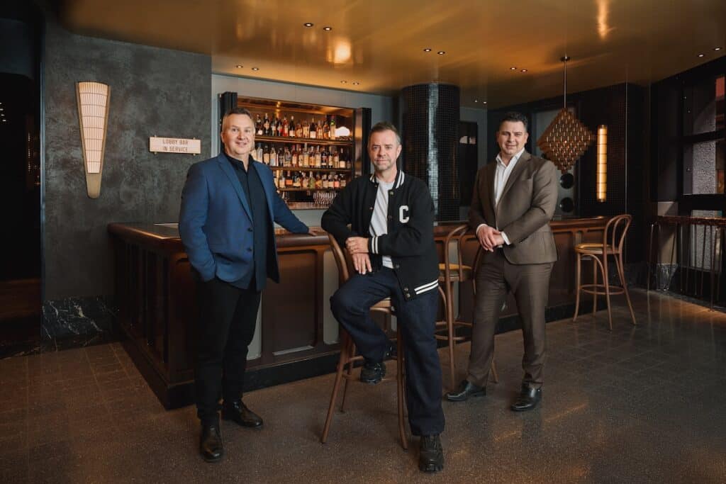 Stylish men in smart casual and formal attire enjoying a sophisticated night at a luxury bar in Sydney, Australia.