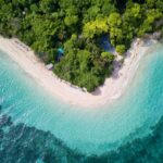 An aerial view of a beach in Tropical North Queensland - Luxury Escapes