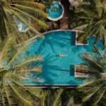An aerial of a woman in the pool at The Haven Khao Lak - Luxury Escapes